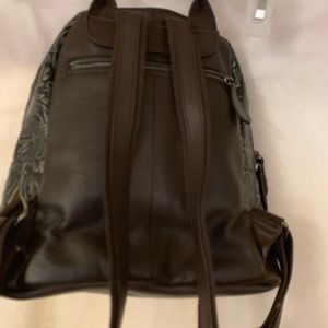 Leather backpack purse. With tooled gold carving
